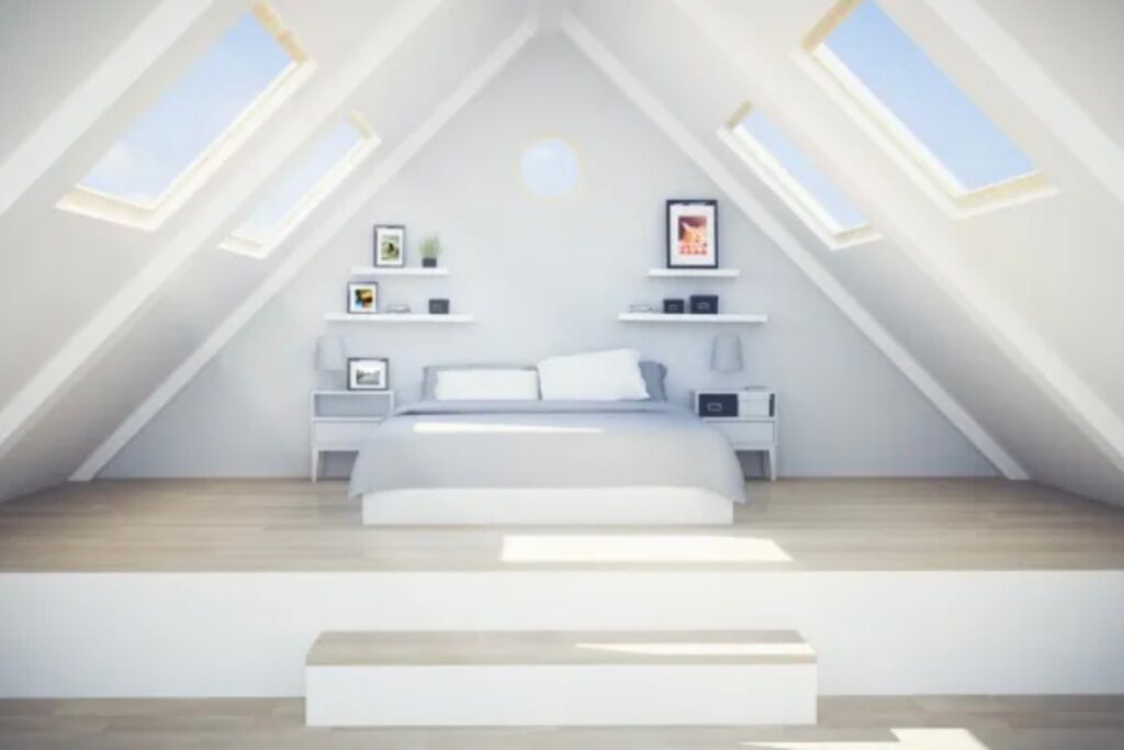 A converted loft room with large windows on the slanted walls