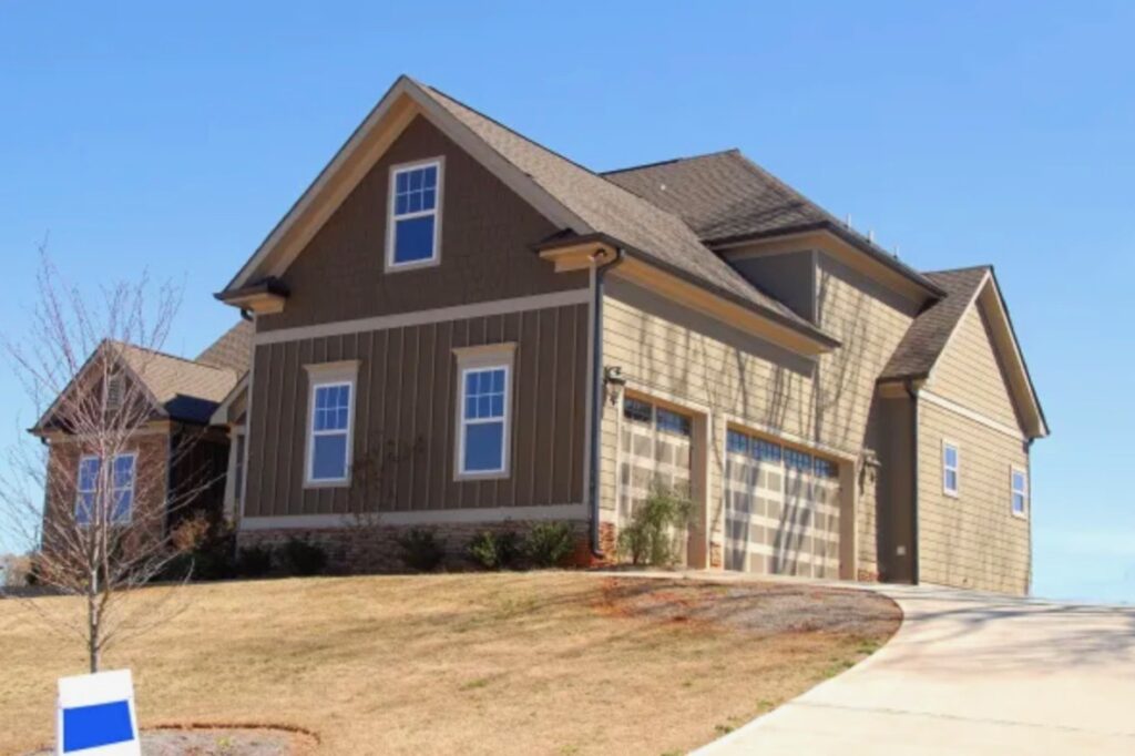 A brown house set on a hill