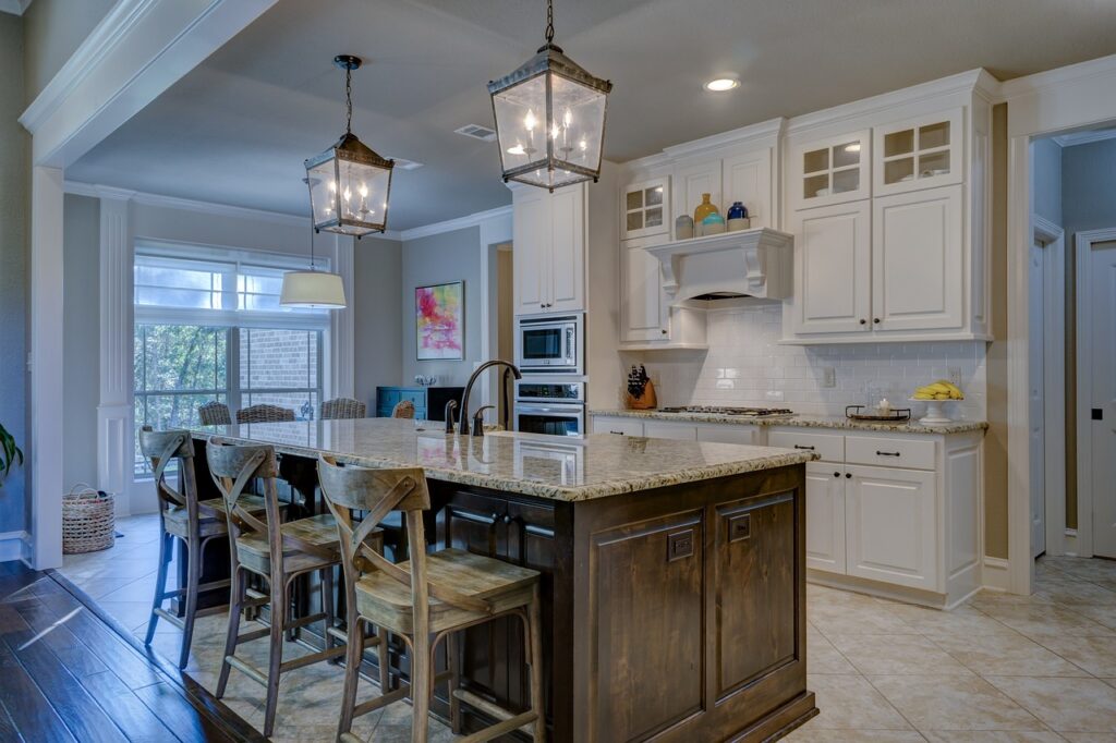 Experts in kitchen design provide valuable tips for creating a functional and stylish space that includes a center island and bar stools.