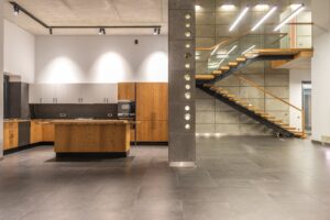 A reliable kitchen with a staircase.