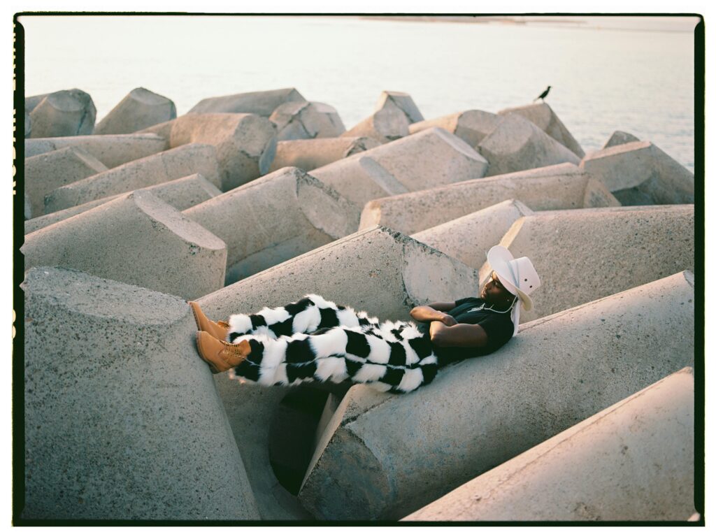 A person is lying on top of a concrete block, showcasing the advancements in concrete technology.