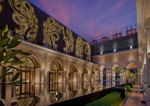 Elegant architectural corridor with ornate details and best places to visit in Chennai at dusk.